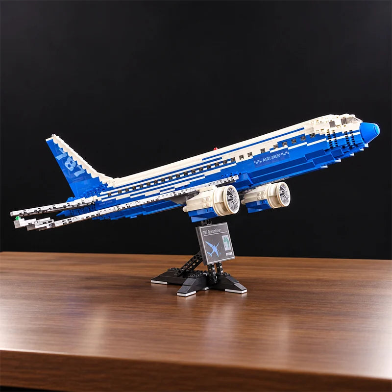 Front view of a Boeing 787 Dreamliner building blocks airplane model featuring detailed jet engines, blue and white livery, and a display stand.