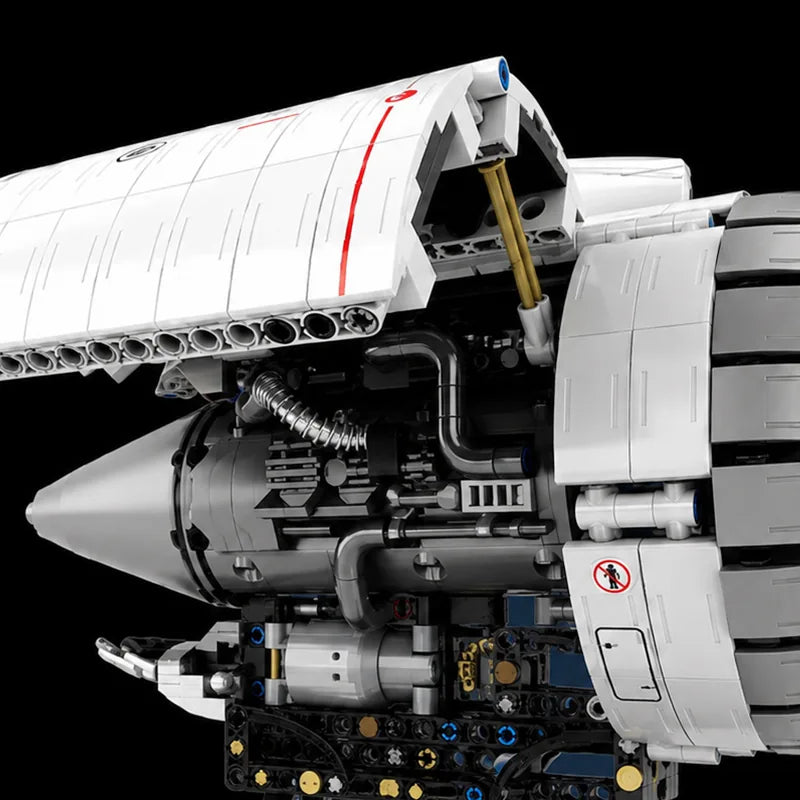 Internal mechanical detail beneath an opening engine shell