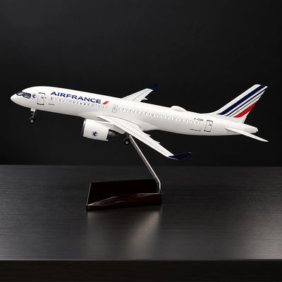 Air France Airbus A220-300 1:100 scale model airplane with detailed livery and display stand.