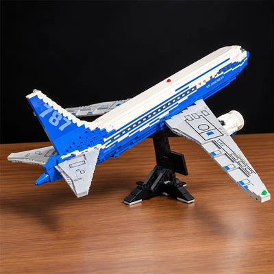 Front view of a Boeing 787 Dreamliner building blocks airplane model featuring detailed jet engines, blue and white livery, and a display stand.