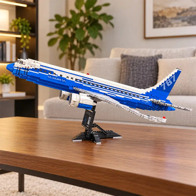 Front view of a Boeing 787 Dreamliner building blocks airplane model featuring detailed jet engines, blue and white livery, and a display stand.