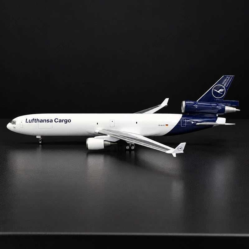 Lufthansa Cargo MD-11F 1:130 scale model airplane with three-engine cargo design and display stand.