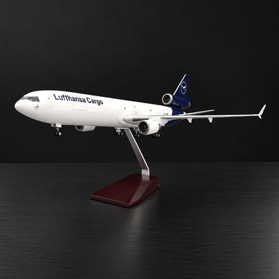 Lufthansa Cargo MD-11F 1:130 scale model airplane with three-engine cargo design and display stand.