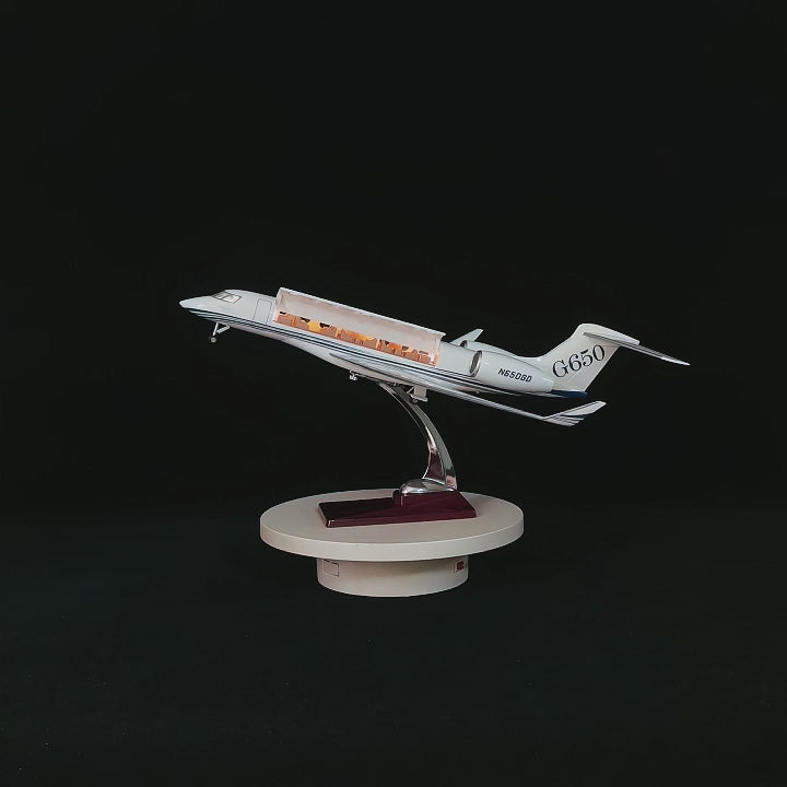 1:50 scale Gulfstream G650 private jet model with openable cabin doors and luxury interior detail on a solid wood base by xairmodel